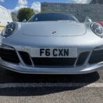 Front number plate law UK: white F6 CXN front plate fitted centrally on a Porsche 911