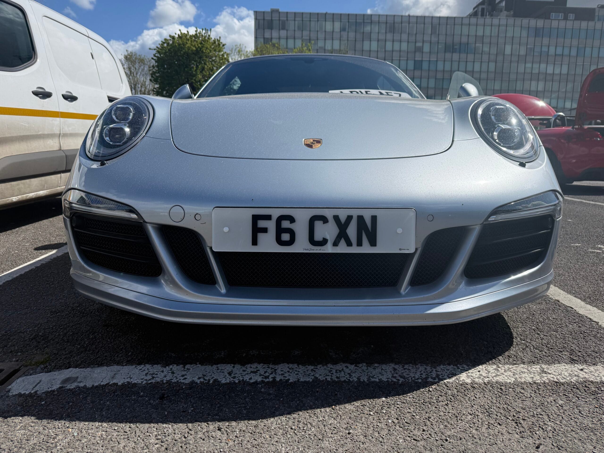 Front number plate law UK: white F6 CXN front plate fitted centrally on a Porsche 911