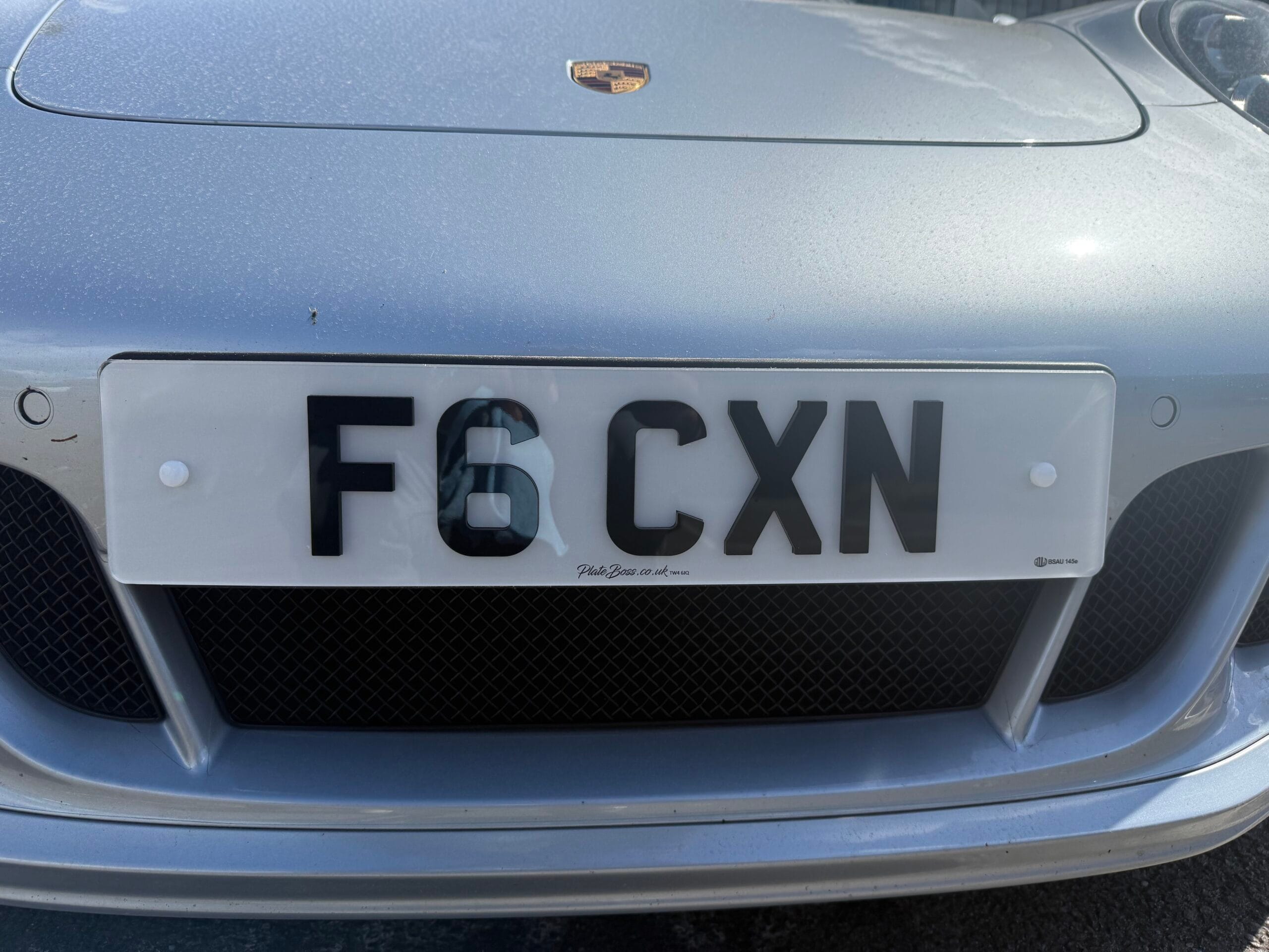 Number plate spacing done correctly: F6 CXN private plate on a Porsche