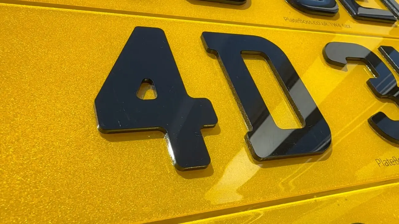 Are 4D plates legal? Close-up of raised 4D laser-cut characters on a road-legal PlateBoss plate
