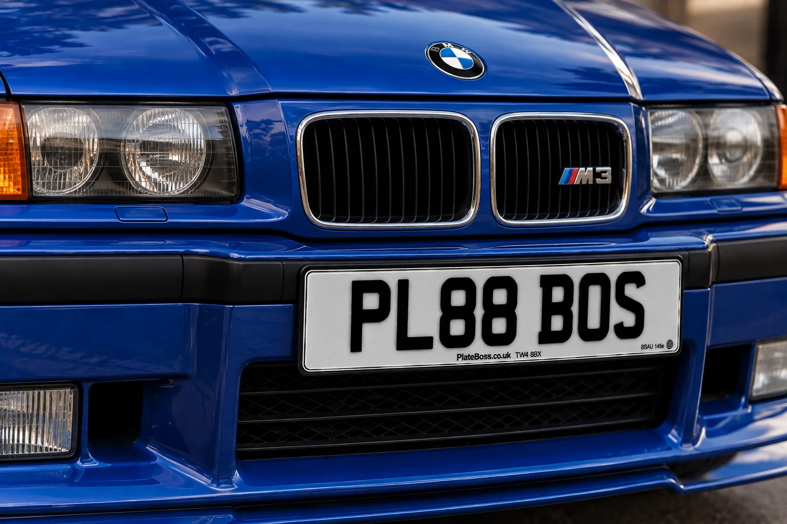 Road-legal white front number plate on a blue BMW M3, demo registration PL88 BOS