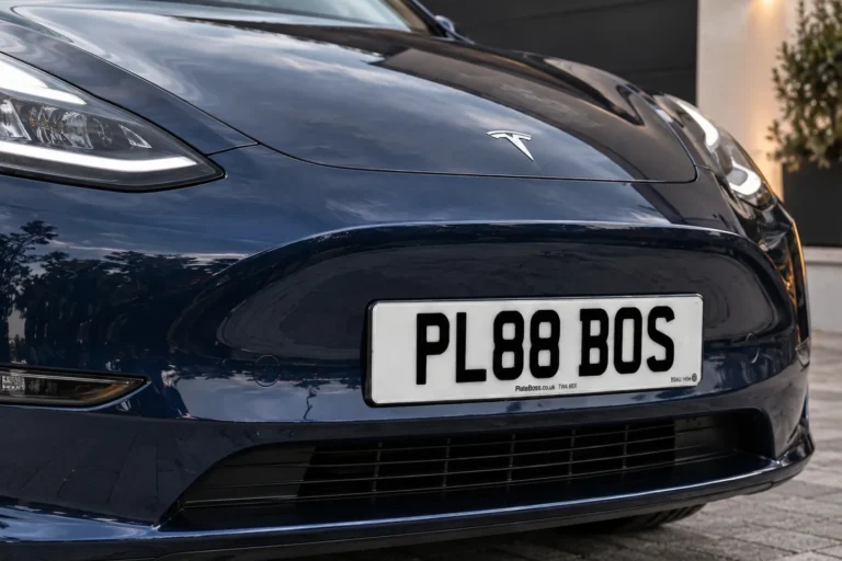Road-legal front number plate fitted to the bumper of a Tesla, demo registration PL88 BOS