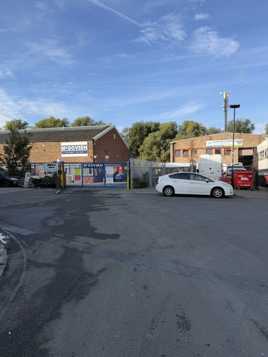 End of Amberley Way in Hounslow, with the blue McGovern gates ahead