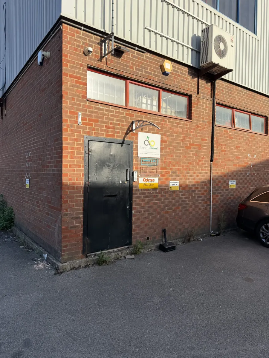 Black entrance door to PlateBoss at Unit 5, The Freehold Centre